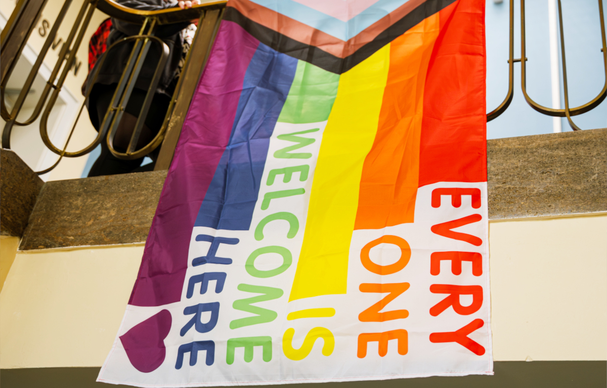 A rainbow flag saying 