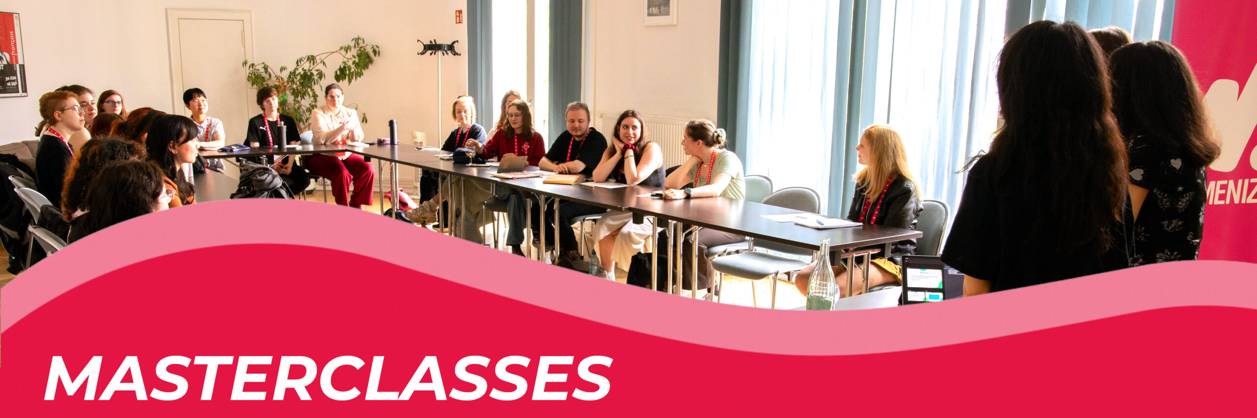 Header_masterclasses Page header for the W! Masterclasses, showing participants in a session room